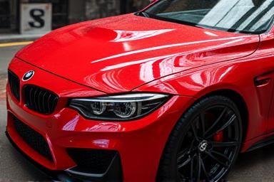A car with an exceptionally glossy finish due to the CleanHub Ultimate Ceramic coating.